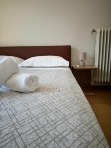 Postel nebo postele na pokoji v ubytování Hotel Locanda Castagnola