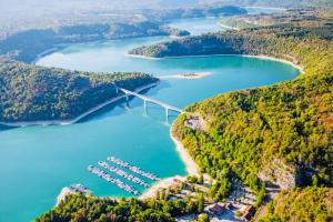 an aerial view of a bridge over a body of water at La Ferme 3 in Arinthod +3 photos