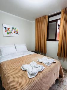 Ένα ή περισσότερα κρεβάτια σε δωμάτιο στο Hostal El Gran Gocta