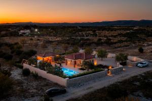 an aerial view of a villa with a pool at sunset at Holiday home Lunnis - Total peace and serenity in Velika Čista
