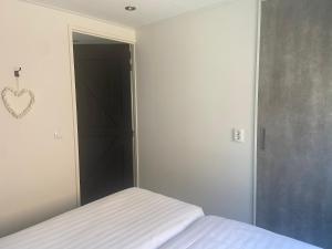 Ένα ή περισσότερα κρεβάτια σε δωμάτιο στο Het Paalhoofd 3 personen