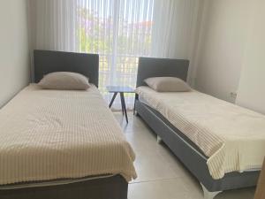 Postel nebo postele na pokoji v ubytování Konyaaltı tatil evleri & konaklama Türkiye - Antalya