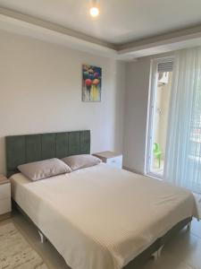 Postel nebo postele na pokoji v ubytování Konyaaltı tatil evleri & konaklama Türkiye - Antalya
