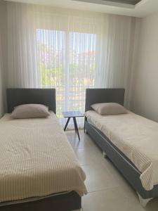 Postel nebo postele na pokoji v ubytování Konyaaltı tatil evleri & konaklama Türkiye - Antalya