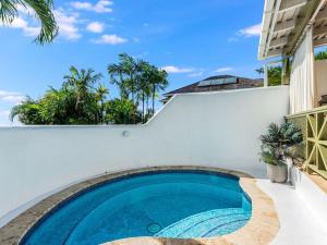 a swimming pool in the backyard of a villa at Tamarind Villa - Sugar Hill in Saint James