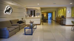 Uma área de estar em Cóndor Suites Apart Hotel