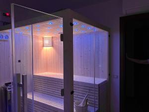 a wooden sauna with a light in a room at Casa Martina in Zogno +41 photos