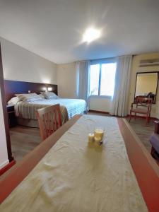 Cama ou camas em um quarto em Cóndor Suites Apart Hotel