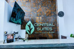 a sign for a center for cultural services on a wall at Central Suites by H&R in Villeta