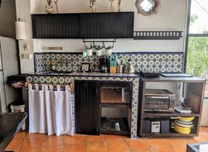 a kitchen with a stove and a counter top at Spacious Studio Boasting Breathtaking Views in Guanajuato