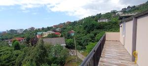 a balcony with a view of a mountain at Golden Heart in Batumi