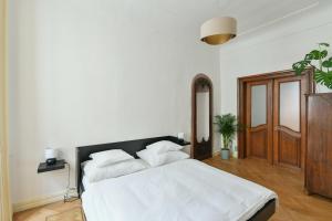 Posteľ alebo postele v izbe v ubytovaní U Kapra Apartments