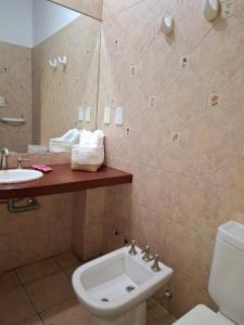a bathroom with a sink and a toilet at La Teresita Hotel Boutique in Salta +10 photos