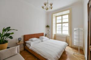 Posteľ alebo postele v izbe v ubytovaní U Kapra Apartments