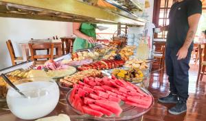 a buffet with many different types of food on a table at Mirante de Lençóis in Lençóis