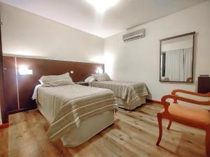Cama ou camas em um quarto em Cóndor Suites Apart Hotel