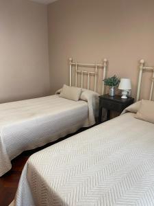 A bed or beds in a room at RECUNCHO DA LUZ