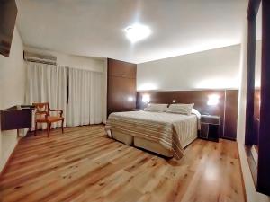 Cama ou camas em um quarto em Cóndor Suites Apart Hotel