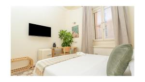 TV a/nebo společenská místnost v ubytování Green Guest House Alghero