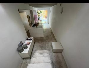 a room with a hallway with white walls at Casa evelina in Santarcangelo di Romagna