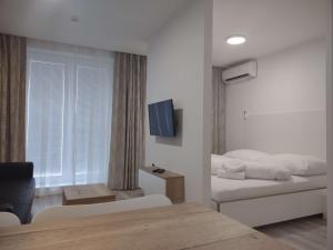 Postel nebo postele na pokoji v ubytování Apartman Kyjev 2