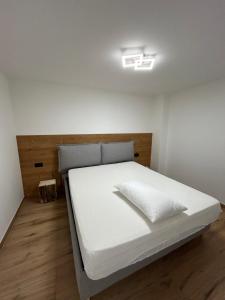 Ένα ή περισσότερα κρεβάτια σε δωμάτιο στο Baita del Sole