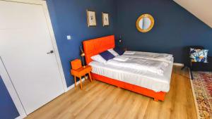 Posteľ alebo postele v izbe v ubytovaní Uroczy Penthouse