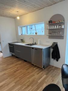 a kitchen with a sink and a counter at Vacationhouse in Klakvik in Klaksvík