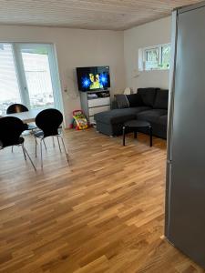 a living room with a couch and a table at Vacationhouse in Klakvik in Klaksvík