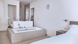 Ein Bett oder Betten in einem Zimmer der Unterkunft Hotel Baobab Suites