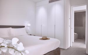 Ein Bett oder Betten in einem Zimmer der Unterkunft Hotel Baobab Suites