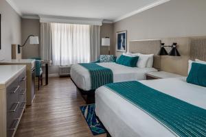 Postel nebo postele na pokoji v ubytování Delray Sands Resort