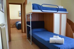 Postel nebo postele na pokoji v ubytování Hotel Miramare
