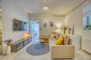 a living room with a couch and a table at Apartman Ivan in Posedarje