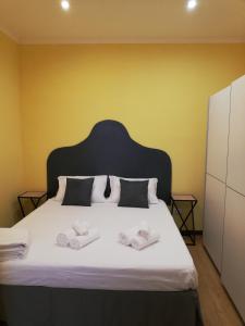 Postel nebo postele na pokoji v ubytování Candelieri Suites