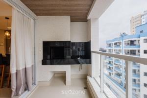 a balcony with a view of a building at Apto 3Q sofisticado apenas 200m da praia SEO0702 in Meia Praia