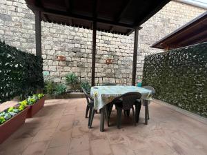 a table and chairs sitting on a patio at In Riva al Mare in Gela
