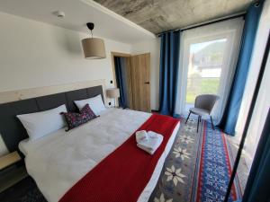 Postel nebo postele na pokoji v ubytování USTROŃ RESIDENCE by VillaOlimpijska2