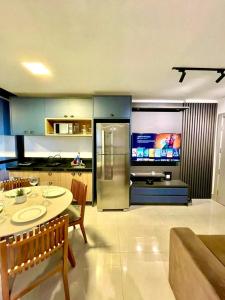 Una televisión o centro de entretenimiento en Flat Alto, Completo e com Linda Vista no Vertigo