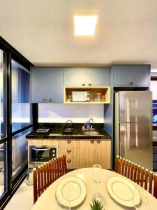 Una cocina o cocineta en Flat Alto, Completo e com Linda Vista no Vertigo