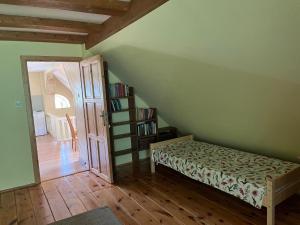Łóżko lub łóżka w pokoju w obiekcie Agroturystyka Niezapominajka