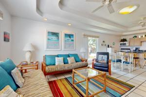 a living room with a couch and a table at Marlin Street Tomehome A in South Padre Island