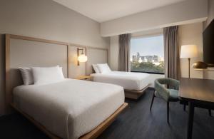 A bed or beds in a room at Fairfield by Marriott Lima Miraflores