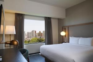 A bed or beds in a room at Fairfield by Marriott Lima Miraflores