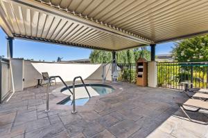 a pergola over a swimming pool on a patio at Best Western Garden Inn in Santa Rosa