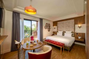 Postel nebo postele na pokoji v ubytování Barceló Palmeraie Oasis Resort