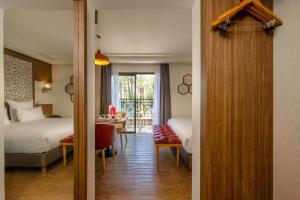 Postel nebo postele na pokoji v ubytování Barceló Palmeraie Oasis Resort