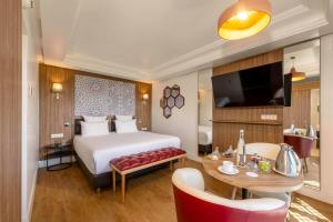 Postel nebo postele na pokoji v ubytování Barceló Palmeraie Oasis Resort
