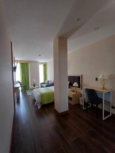 Postel nebo postele na pokoji v ubytování Hotel Puerto Limón CR