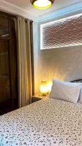 Ένα ή περισσότερα κρεβάτια σε δωμάτιο στο Raid Maison H